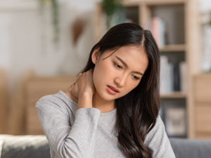 Woman holding neck